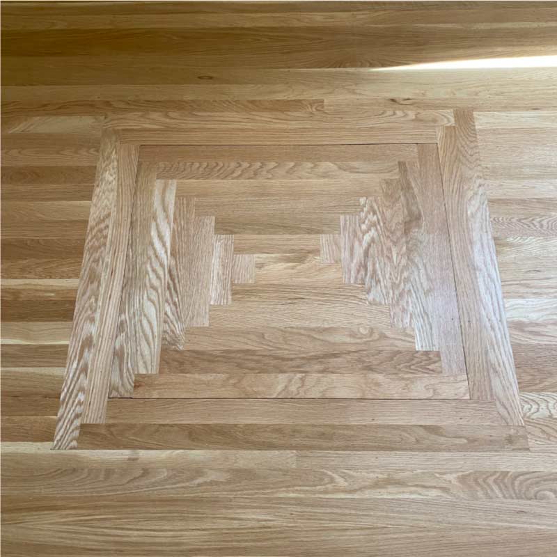 Create a one-of-a-kind look with our custom hardwood floor inlays